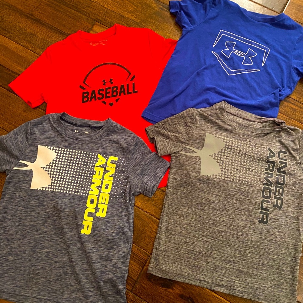 Four YS Under Armour short sleeve tops